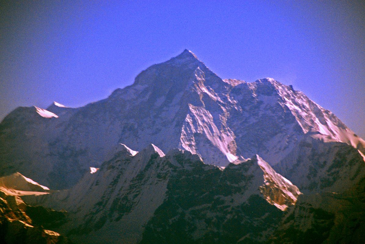 Kathmandu Mountain Flight 09-1 Makalu The sun backlights Makalu, the fifth highest mountain in the world, making it a bit hard to see Makalu as the Kathmandu Mountain Flight turns around to head back to Kathmandu.